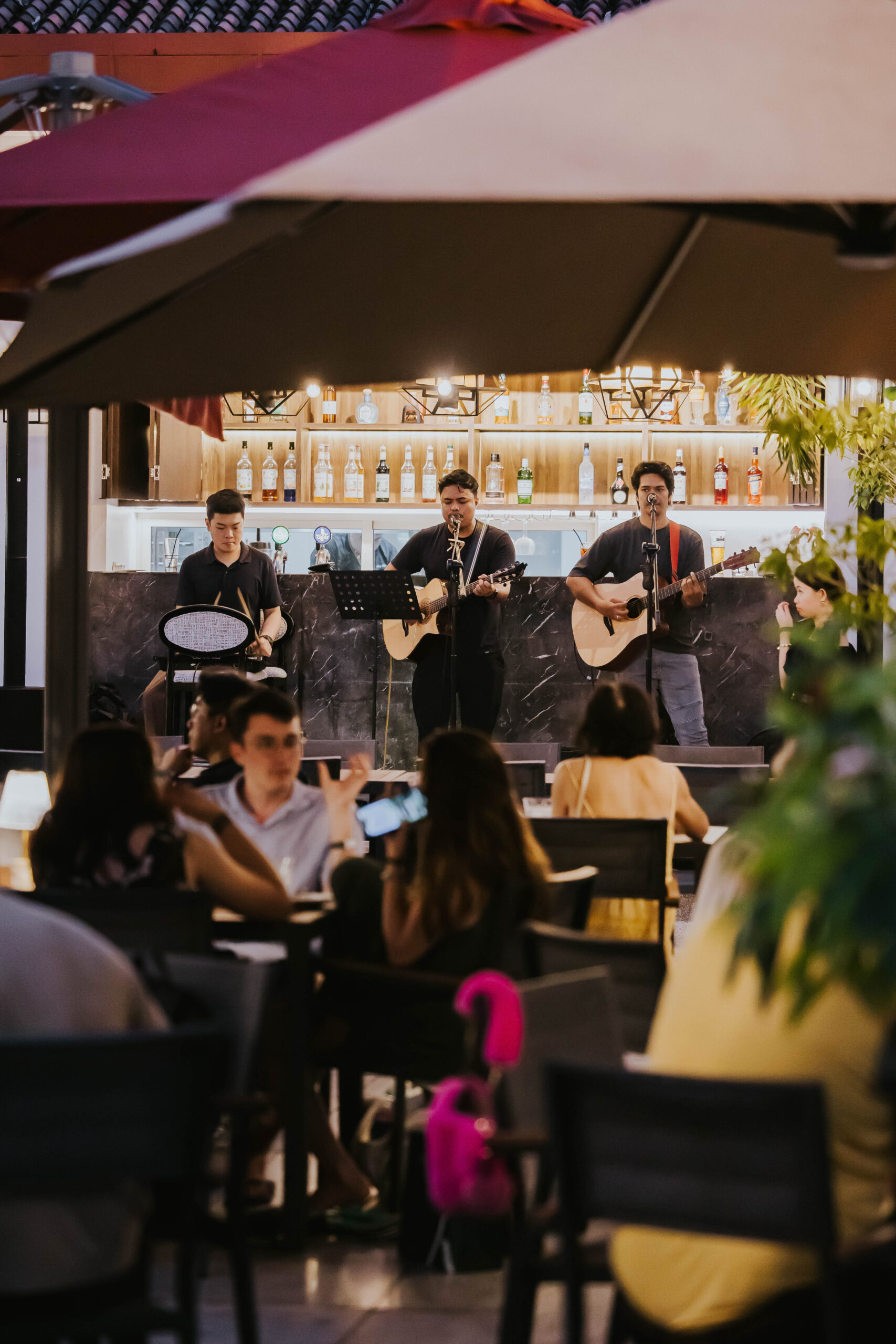 Live acoustic band performing for guests at 1918 Heritage Bar, The Alkaff Mansion Singapore